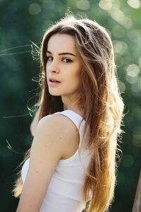 Photo of a beautiful young girl on nature from close angle
